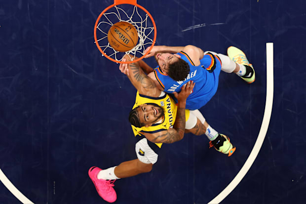 Indiana Pacers forward Obi Toppin battles Oklahoma City Thunder forward Chet Holmgren.