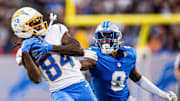 LA Chargers wide receiver KeAndre Lambert-Smith (84) makes a catch against Detroit Lions cornerback Ennis Rakestraw Jr. (9) during the first half of the Hall of Fame Game at Tom Benson Hall of Fame Stadium in Canton, Ohio on Thursday, July 31, 2025.