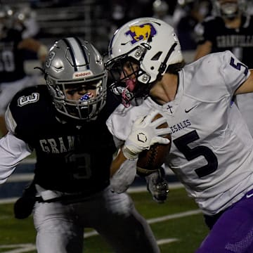 Granville junior Mikey Chaykowski pursues DeSales' Kyle Nicely during Friday night's Division III, Region 11 quarterfinal at Walter Hodges Stadium. The Blue Aces defeated the visiting Stallions 19-12 and will face London in the regional semifinals.

Granville 19 Desales 12