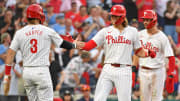 Jun 17, 2024; Philadelphia, Pennsylvania, USA; Philadelphia Phillies third base Alec Bohm (28) celebrates his home run with first base Bryce Harper (3) and shortstop Trea Turner (7) during the fifth inning against the San Diego Padres at Citizens Bank Park.