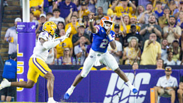 Sep 13, 2025; Baton Rouge, Louisiana, USA;  Florida Gators quarterback DJ Lagway (2) passes against LSU Tigers defensive end Patrick Payton (6) during the first half at Tiger Stadium. Mandatory Credit: Stephen Lew-Imagn Images