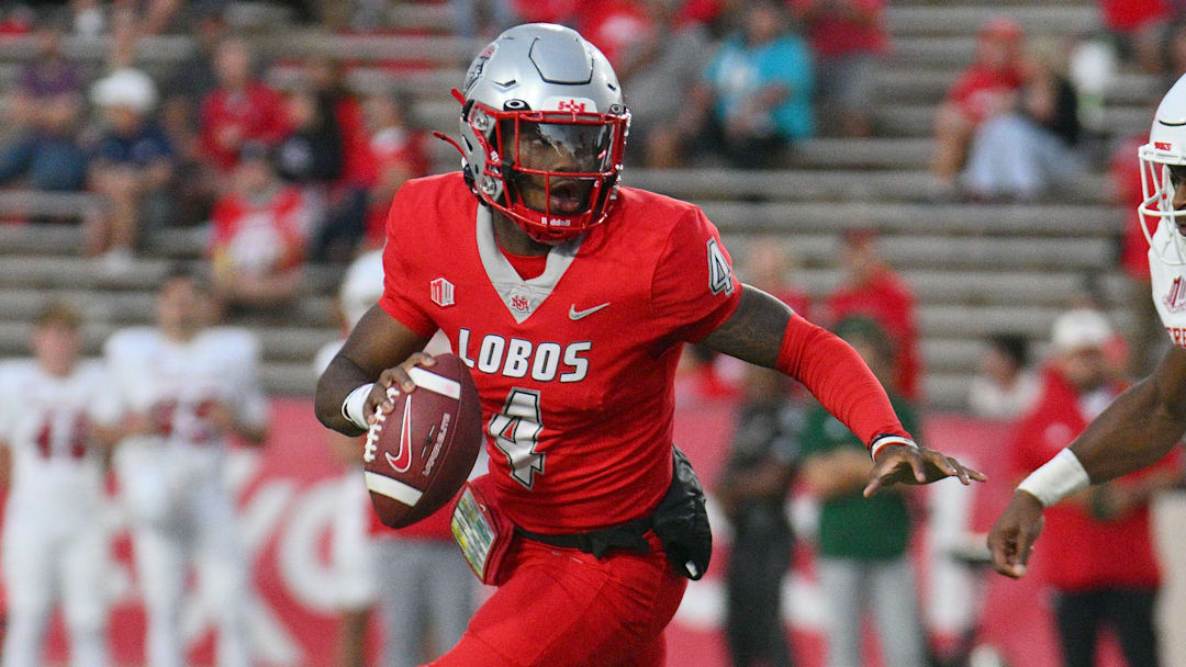 Quarterback Devon Dampier #4 of the New Mexico Lobos runs for yardage against linebacker Malachi Langley #9 of the Fresno State Bulldogs during the first half at University Stadium on September 21, 2024 in Albuquerque, New Mexico. 