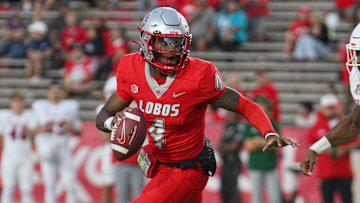 Quarterback Devon Dampier #4 of the New Mexico Lobos runs for yardage against linebacker Malachi Langley #9 of the Fresno State Bulldogs during the first half at University Stadium on September 21, 2024 in Albuquerque, New Mexico. 