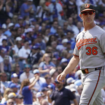 Aug 3, 2025; Chicago, Illinois, USA; Baltimore Orioles interim manager Tony Mansolino (36) makes a pitching change against the Chicago Cubs during the fifth inning at Wrigley Field. 