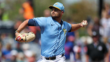 Tampa Bay Rays pitcher Shane McClanahan (18) throws a pitch against the New York Mets in the first inning during spring training at Charlotte Sports Park. 