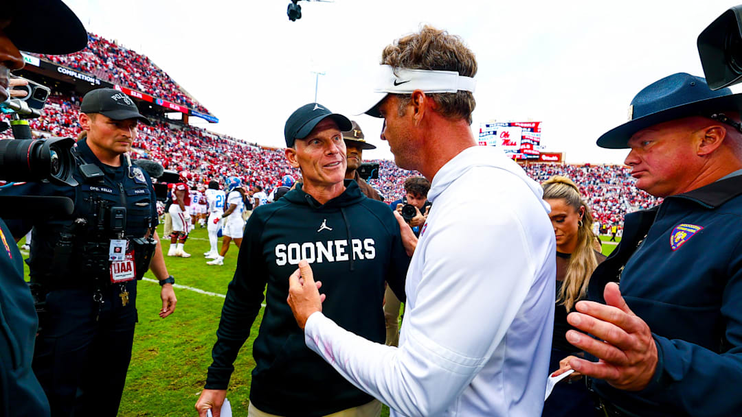 Ole Miss Rebels head coach Lane Kiffin (right) greets Oklahoma Sooners head coach Brent Venables (left) after the game at Gaylord Family-Oklahoma Memorial Stadium. Credit: Kevin Jairaj-Imagn Images
