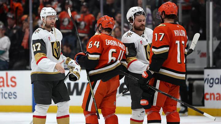 May 14, 2026; Anaheim, California, USA; Vegas Golden Knights defenseman Ben Hutton (17) and defenseman Rasmus Andersson (4) greet Anaheim Ducks center Mikael Granlund (64) and left wing Alex Killorn (17) after game six of the second round of the 2026 Stanley Cup Playoffs at Honda Center. Mandatory Credit: Kiyoshi Mio-Imagn Images