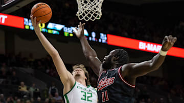 Oregon center Nate Bittle rebounds the ball over Indiana center Oumar Ballo as the Oregon Ducks host the Indiana Hoosiers Tuesday, March 4, 2025, at Matthew Knight Arena in Eugene, Ore.