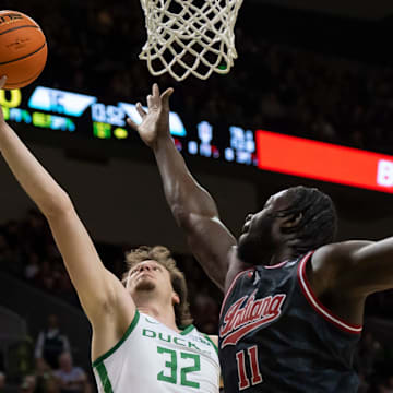 Oregon center Nate Bittle rebounds the ball over Indiana center Oumar Ballo as the Oregon Ducks host the Indiana Hoosiers Tuesday, March 4, 2025, at Matthew Knight Arena in Eugene, Ore.