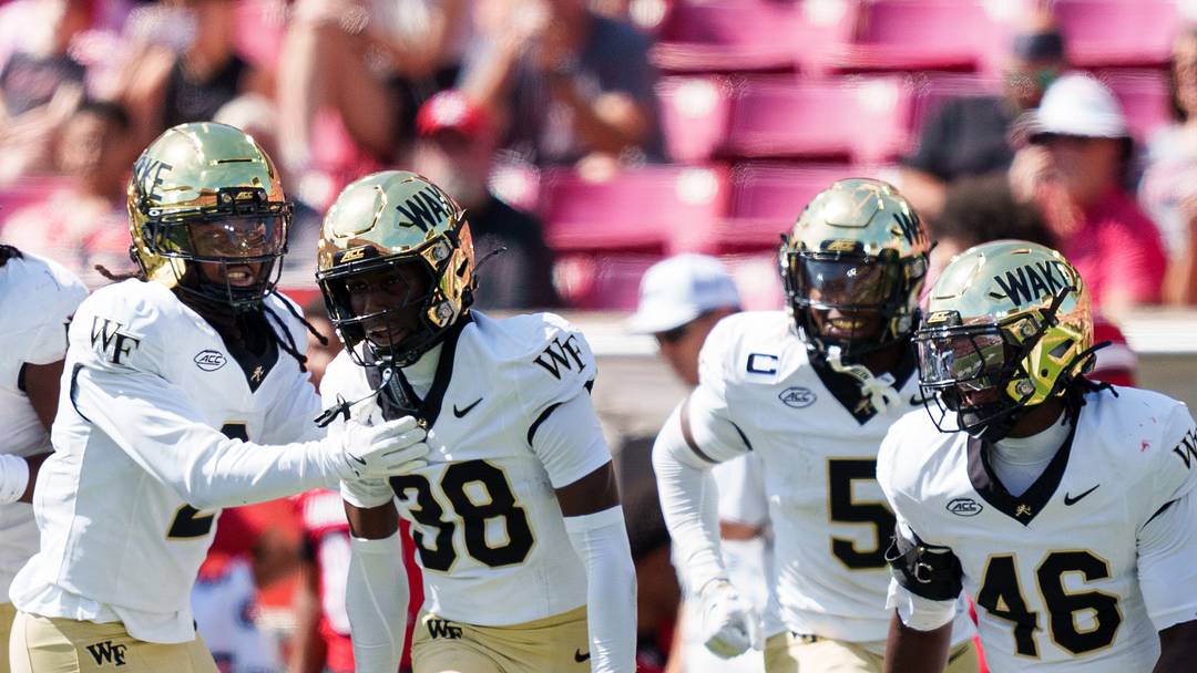 Defensive back Somad Eaddy (38) celebrates with teammates after an interception against Louisville Mandatory Credit: Chris Carter-Imagn Images
