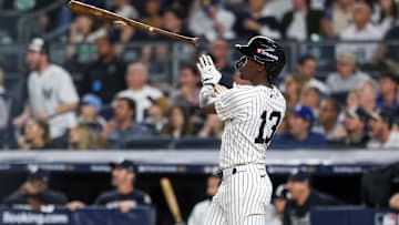 Oct 7, 2025; Bronx, New York, USA; New York Yankees second baseman Jazz Chisholm Jr. (13) hits a solo home run in the fifth inning against the Toronto Blue Jays during game three of the ALDS round for the 2025 MLB playoffs at Yankee Stadium. Mandatory Credit: Vincent Carchietta-Imagn Images