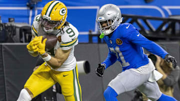 Nov 27, 2025; Detroit, Michigan, USA; Green Bay Packers wide receiver Christian Watson (9) catches a pass against Detroit Lions cornerback Amik Robertson (21) during the third quarter at Ford Field.