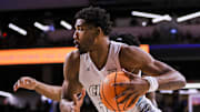 Jan 21, 2025; Cincinnati, Ohio, USA; Cincinnati Bearcats forward Arrinten Page (22) drives to the basket against the Texas Tech Red Raiders in the first half at Fifth Third Arena. Mandatory Credit: Katie Stratman-Imagn Images