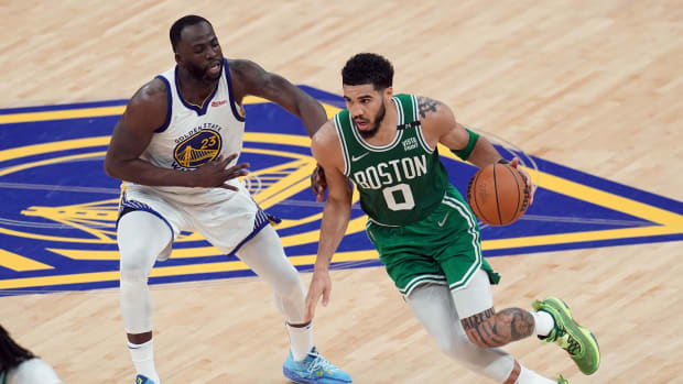 Jun 5, 2022; San Francisco, California, USA; Boston Celtics forward Jayson Tatum (0) controls the ball against Golden State Warriors forward Draymond Green (23) in the second quarter during game two of the 2022 NBA Finals at Chase Center. Mandatory Credit: Cary Edmondson-USA TODAY Sports