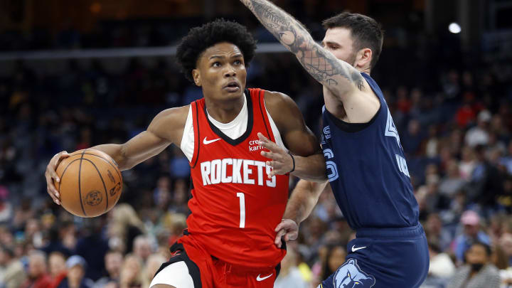 Feb 14, 2024; Memphis, Tennessee, USA; Houston Rockets forward Amen Thompson (1) drives to the basket as Memphis Grizzlies guard John Konchar (46) defends during the second half at FedExForum. Mandatory Credit: Petre Thomas-USA TODAY Sports