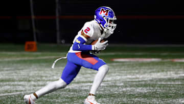 Monroe’s Messiah Amare Hampton returns a kickoff against Canandaigua.