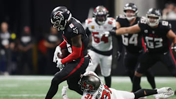 Sep 7, 2025; Atlanta, Georgia, USA; Tampa Bay Buccaneers safety Antoine Winfield Jr. (31) tackles Atlanta Falcons tight end Kyle Pitts Sr. (8) during the third quarter at Mercedes-Benz Stadium. Mandatory Credit: Brett Davis-Imagn Images