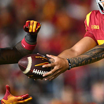 Sep 7, 2024; Los Angeles, California, USA; USC Trojans quarterback Jayden Maiava (14) hands off the ball to USC Trojans running back Bryan Jackson (21) against the Utah State Aggies during the third quarter at United Airlines Field at Los Angeles Memorial Coliseum. Mandatory Credit: Jonathan Hui-Imagn Images