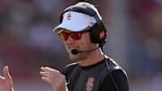 Aug 30, 2025; Los Angeles, California, USA; Southern California Trojans head coach Lincoln Riley watches from the sidelines against the Missouri State Bears in the first half at United Airlines Field at Los Angeles Memorial Coliseum. Mandatory Credit: Kirby Lee-Imagn Images