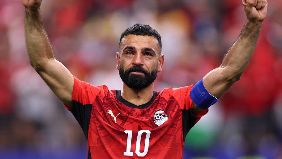 Mohamed Salah arms raised.