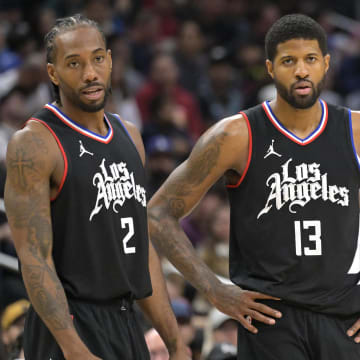 Feb 10, 2024; Los Angeles, California, USA;   Los Angeles Clippers forward Kawhi Leonard (2) and forward Paul George (13) look on in the second half against the Detroit Pistons at Crypto.com Arena. Mandatory Credit: Jayne Kamin-Oncea-USA TODAY Sports