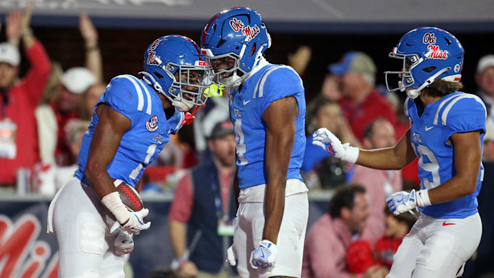 Nov 15, 2025; Oxford, Mississippi, USA; Mississippi Rebels tight end Caleb Odom (4) and wide receiver Cayden Lee (19) react with wide receiver De'Zhaun Stribling (1) after a touchdown during the second quarter against the Florida Gators at Vaught-Hemingway Stadium. Mandatory Credit: Petre Thomas-Imagn Images