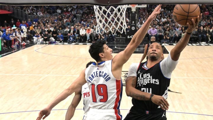 Feb 10, 2024; Los Angeles, California, USA;  Los Angeles Clippers guard Norman Powell (24) drives past Detroit Pistons Simone Fontecchio (19) in the second half at Crypto.com Arena. Mandatory Credit: Jayne Kamin-Oncea-USA TODAY Sports