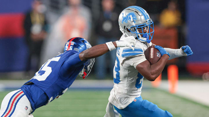 Aug 8, 2024; East Rutherford, New Jersey, USA; Detroit Lions wide receiver Isaiah Williams (83) gains yards after catch as New York Giants running back Jashaun Corbin (35) pursues during the second half at MetLife Stadium. Mandatory Credit: Vincent Carchietta-USA TODAY Sports