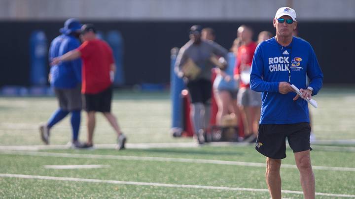 Kansas head coach Lance Leipold walks the field at the start of Tuesday's outdoor practice.