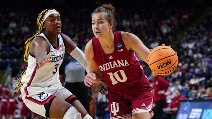 Indiana Hoosiers forward Aleksa Gulbe (10) drives the ball against UConn Huskies forward Aaliyah Edwards (3) during the first half in the Bridgeport regional semifinals of the women's college basketball NCAA Tournament at Webster Bank Arena. Indiana Hoosiers forward Aleksa Gulbe (10) drives the ball against UConn Huskies forward Aaliyah Edwards (3) during the first half in the Bridgeport regional semifinals of the women's college basketball NCAA Tournament at Webster Bank Arena.