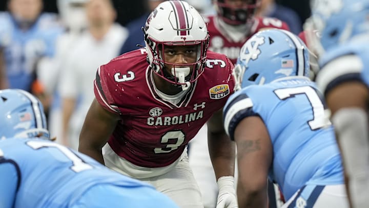 Dec 30, 2021; Charlotte, NC, USA; South Carolina Gamecocks defensive end Jordan Burch (3) eyes the offensive set from the North Carolina Tar Heels during the second half at Bank of America Stadium. Mandatory Credit: Jim Dedmon-Imagn Images