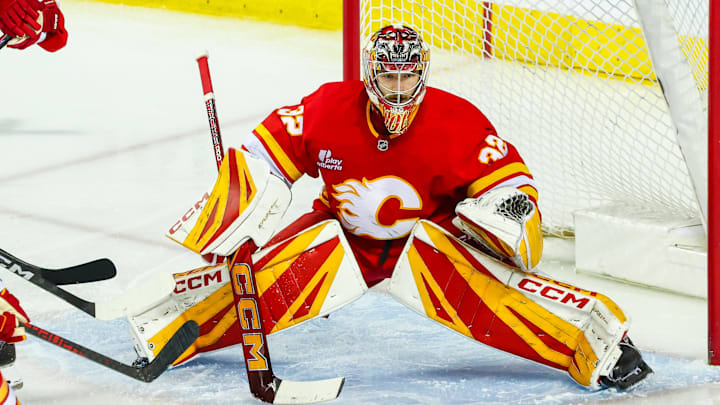 Apr 12, 2026; Calgary, Alberta, CAN; Calgary Flames goaltender Dustin Wolf (32) guards his net against the Utah Mammoth during the third period at Scotiabank Saddledome. Mandatory Credit: Sergei Belski-Imagn Images