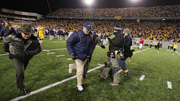 Dec 1, 2007, Morgantown, WV, USA; West Virginia Mountaineer head coach Rich Rodriguez leaves the field after the Mountaineers 13-9 loss to the Pittsburgh Panthers at Mylan Puskar Stadium. Duhart recovered the fumble. Mandatory Credit: Bob Donnan-Imagn Images