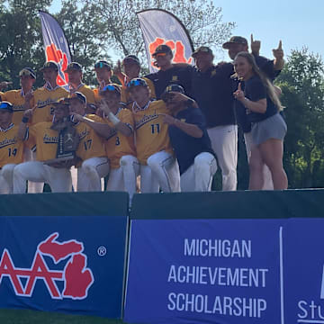 Hartland celebrates after beating Dakota 5-3 in extra innings to win the 2025 MHSAA Division 1 baseball state title.