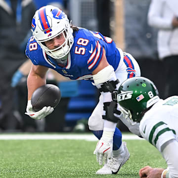 Dec 29, 2024; Orchard Park, New York, USA; Buffalo Bills' linebacker Matt Milano (58) recovers a fumble by the New York Jets in the third quarter against the New York Jets at Highmark Stadium.