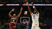 Mar 8, 2025; Pittsburgh, Pennsylvania, USA;  Pittsburgh Panthers forward Zack Austin (55) shoots a three point basket against Boston College Eagles guard Fred Payne (5) during the second half at the Petersen Events Center. Mandatory Credit: Charles LeClaire-Imagn Images