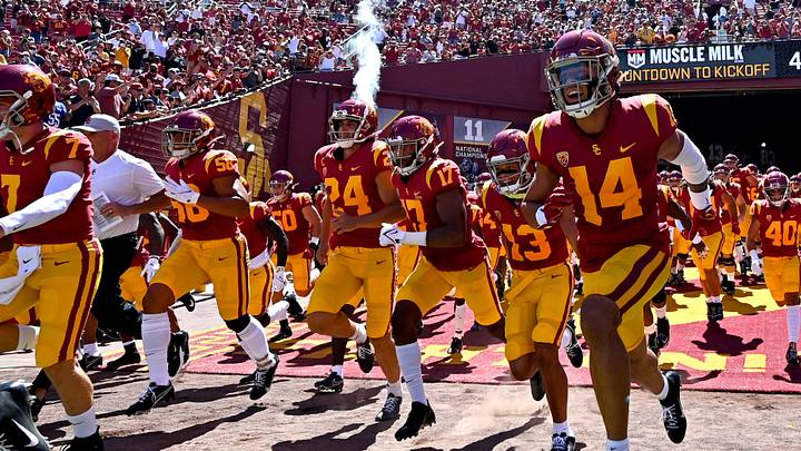 Sep 4, 2021; Los Angeles, California, USA;  USC Trojans run on to the field for a game against the San Jose State Spartans at United Airlines Field at Los Angeles Memorial Coliseum. Mandatory Credit: Jayne Kamin-Oncea-USA TODAY Sports