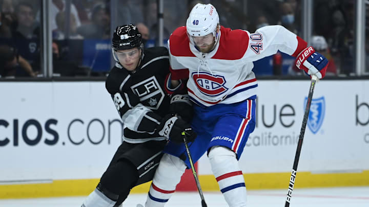 Oct 30, 2021; Los Angeles, California, USA; Los Angeles Kings defenseman Kale Clague (58) defends Montreal Canadiens right wing Joel Armia (40) as he skates the puck down ice in the third period of the game at Staples Center. Mandatory Credit: Jayne Kamin-Oncea-Imagn Images
