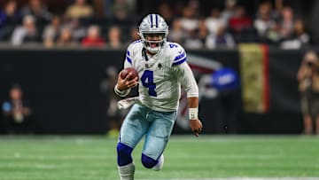 Nov 3, 2024; Atlanta, Georgia, USA; Dallas Cowboys quarterback Dak Prescott (4) scrambles against the Atlanta Falcons in the third quarter at Mercedes-Benz Stadium. Mandatory Credit: Brett Davis-Imagn Images