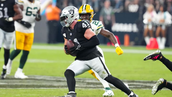 Oct 9, 2023; Paradise, Nevada, USA; Las Vegas Raiders linebacker Robert Spillane (41) runs with the ball after making an interception against the Green Bay Packers during the third quarter at Allegiant Stadium. Mandatory Credit: Stephen R. Sylvanie-USA TODAY Sports