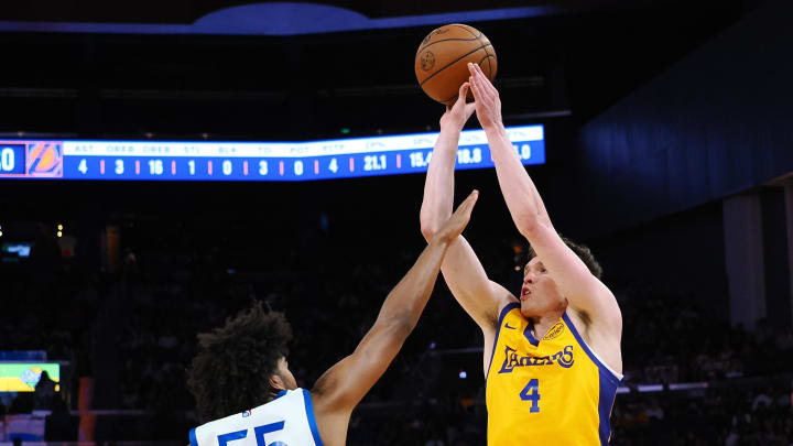 Jul 7, 2024; San Francisco, CA, USA; Los Angeles Lakers guard Dalton Knecht (4) shoots the ball against Golden State Warriors forward/guard Ethan Thompson (55) during the second quarter at Chase Center. Mandatory Credit: Kelley L Cox-USA TODAY Sports