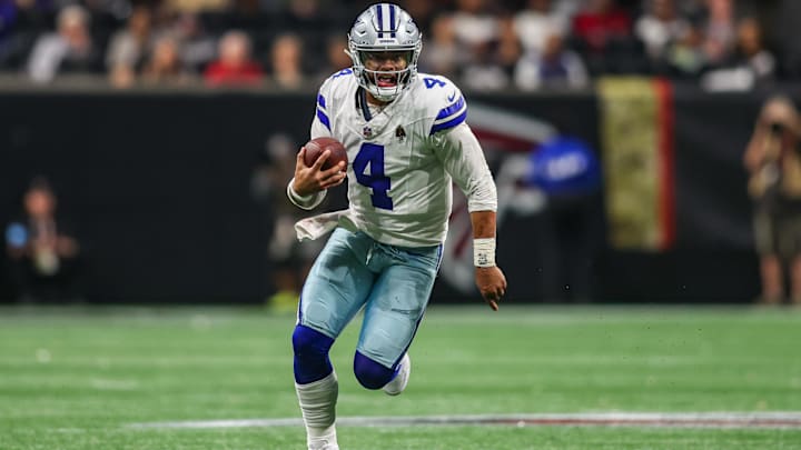 Dallas Cowboys quarterback Dak Prescott scrambles against the Atlanta Falcons in the third quarter at Mercedes-Benz Stadium. Dallas Cowboys quarterback Dak Prescott scrambles against the Atlanta Falcons in the third quarter at Mercedes-Benz Stadium.