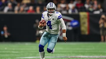 Nov 3, 2024; Atlanta, Georgia, USA; Dallas Cowboys quarterback Dak Prescott (4) scrambles against the Atlanta Falcons in the third quarter at Mercedes-Benz Stadium. Mandatory Credit: Brett Davis-Imagn Images