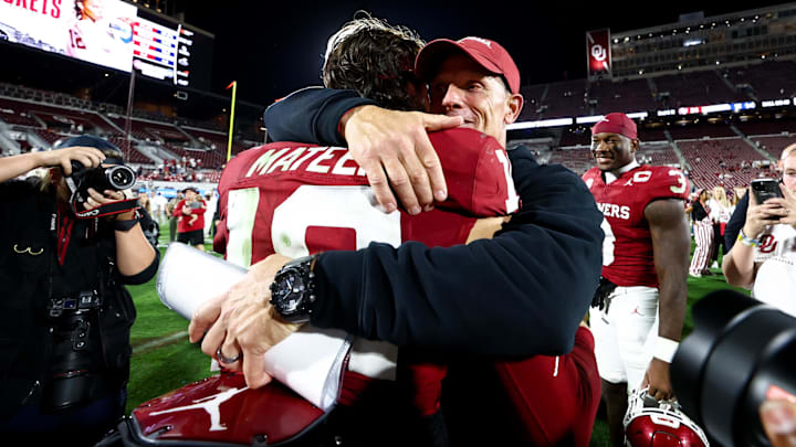 Sep 6, 2025; Norman, Oklahoma, USA;  Oklahoma Sooners quarterback John Mateer (10) celebrates with  head coach Brent Venables after the game against the Michigan Wolverines at Gaylord Family-Oklahoma Memorial Stadium. Mandatory Credit: Kevin Jairaj-Imagn Images