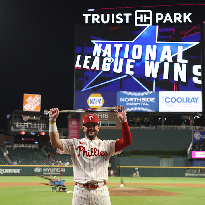 National League designated hitter Kyle Schwarber (12) of the Philadelphia Phillies celebrates after defeating the AL
