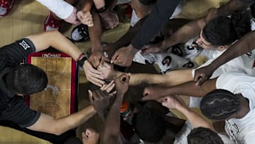 Nov 26, 2025; Cincinnati, Ohio, USA;  Cincinnati Bearcats head coach Wes Miller leads a team huddle during a stop in play against the Eastern Michigan Eagles in the second half at Fifth Third Arena. Mandatory Credit: Aaron Doster-Imagn Images