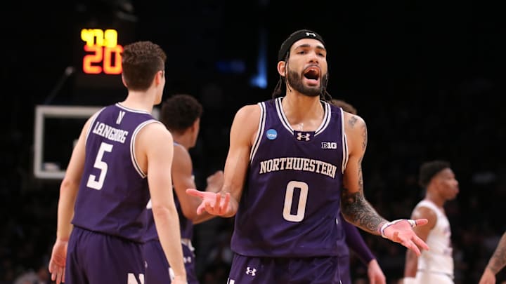 March 22, 2024, Brooklyn, NY, USA; Northwestern Wildcats guard Boo Buie (0) reacts against the Florida Atlantic Owls  in the first round of the 2024 NCAA Tournament at the Barclays Center. Mandatory Credit: Brad Penner-Imagn Images