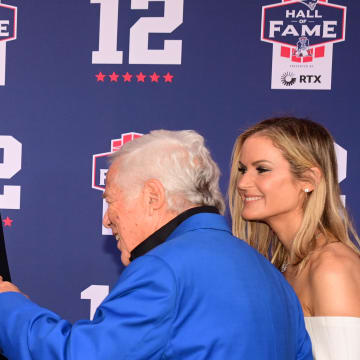 Jun 12, 2024; Foxborough, MA, USA; Tom Brady fist bumps during the New England Patriots Hall oner Robert Kraft at the Patriots Hall Fame induction Ceremony for Tom Brady Mandatory Credit: Eric Canha-USA TODAY Sports