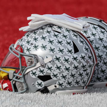Nov 4, 2023; Piscataway, New Jersey, USA; Ohio State Buckeyes helmets rest on the field before the game against the Rutgers Scarlet Knights at SHI Stadium. Mandatory Credit: Vincent Carchietta-USA TODAY Sports