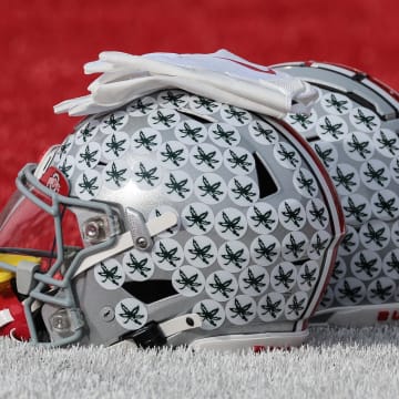 Nov 4, 2023; Piscataway, New Jersey, USA; Ohio State Buckeyes helmets rest on the field before the game against the Rutgers Scarlet Knights at SHI Stadium.